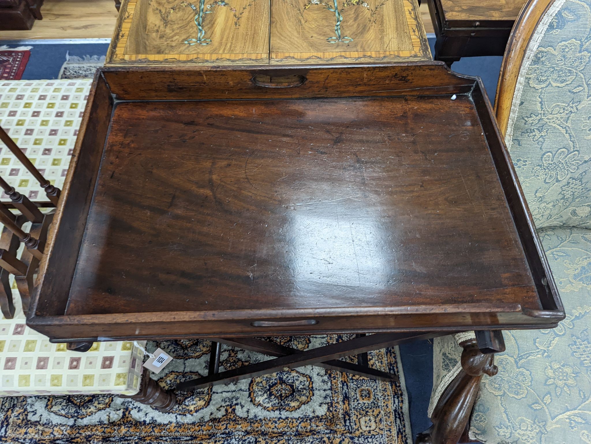 A Victorian rectangular mahogany butler's tray on folding stand, width 74cm, depth 50cm, height 78cm